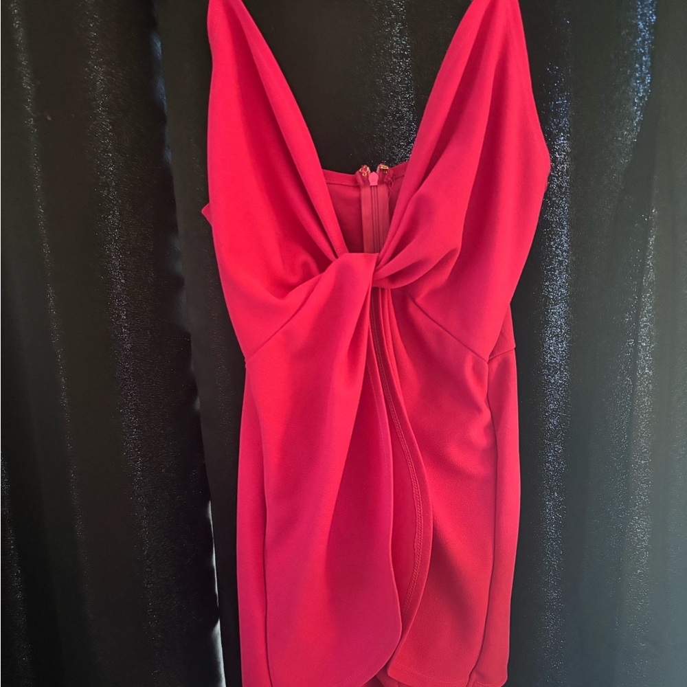 Pink Short Romper with stomach out.